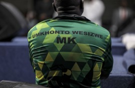 A man wearing a Umkhonto Wesizwe (MK) political party shirt. AFP/Gianluigi Guercia
