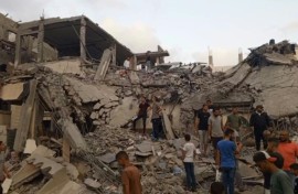 Gazans search through the rubble following Israeli strike on Deir El-Balah
