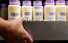 Lifestyle FILE: A member of staff of breast milk bank of the VUmc carries a boxe with bottles containing breast milk in Amsterdam, on August 19, 2020