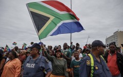 File: A woman waving the South African flag. AFP/Wikus de Wet