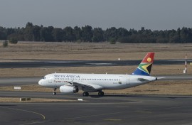 A SAA plane is seen on the tarmac before departing from the OR Tambo International Airport. AFP/Emmanuel Croset