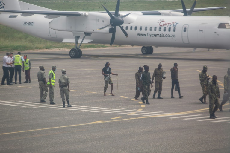 Helicopters carrying humanitarian personnel landed at Pemba airport, alongside a small plane flying troops back from Palma