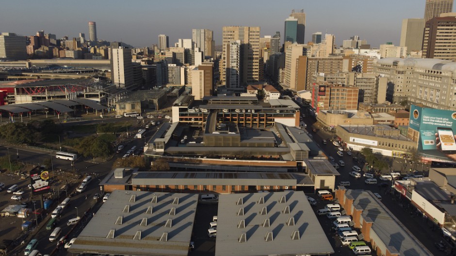 This aerial view shows the Johannesburg skyline and the Bree taxi rank in Newtown, on May 7, 2020.