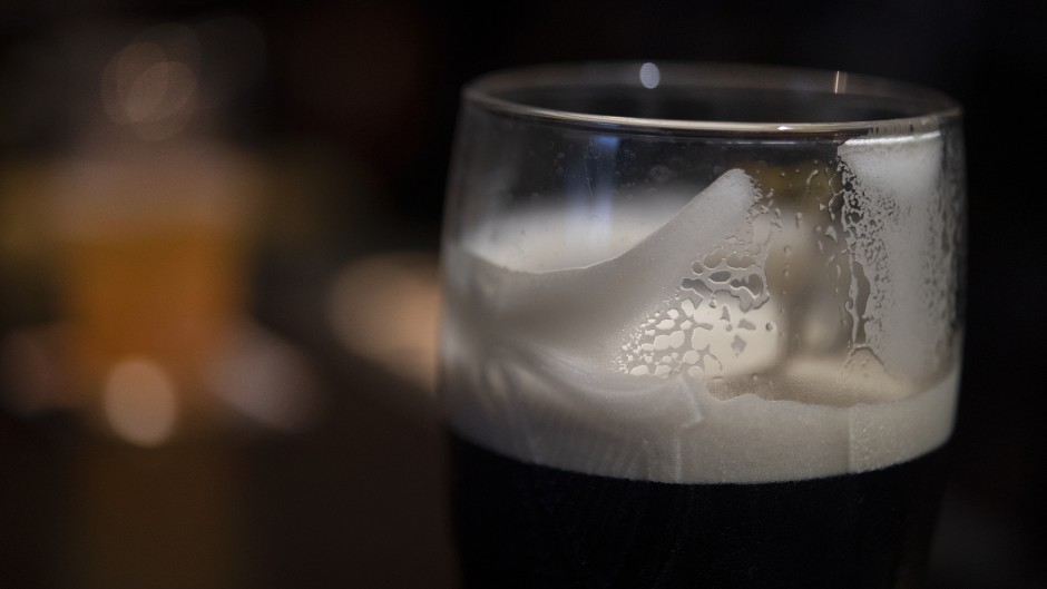 File: A head of foam coats the glass of a daft beer. FRED TANNEAU / AFP