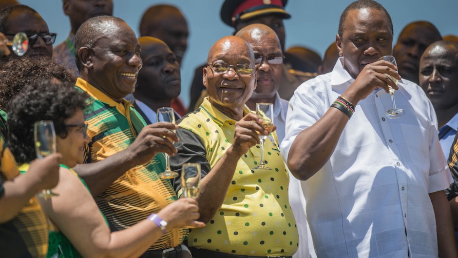 African National Congress (ANC) Deputy Secretary-General Jessie Duarte, ANC President Cyril Ramaphosa, President of South Africa Jacob Zuma and President of Kenya Uhuru Kenyatta toast at Absa Stadium in East London, South Africa, during the ANC's 106th-anniversary celebrations on January 13, 2018.