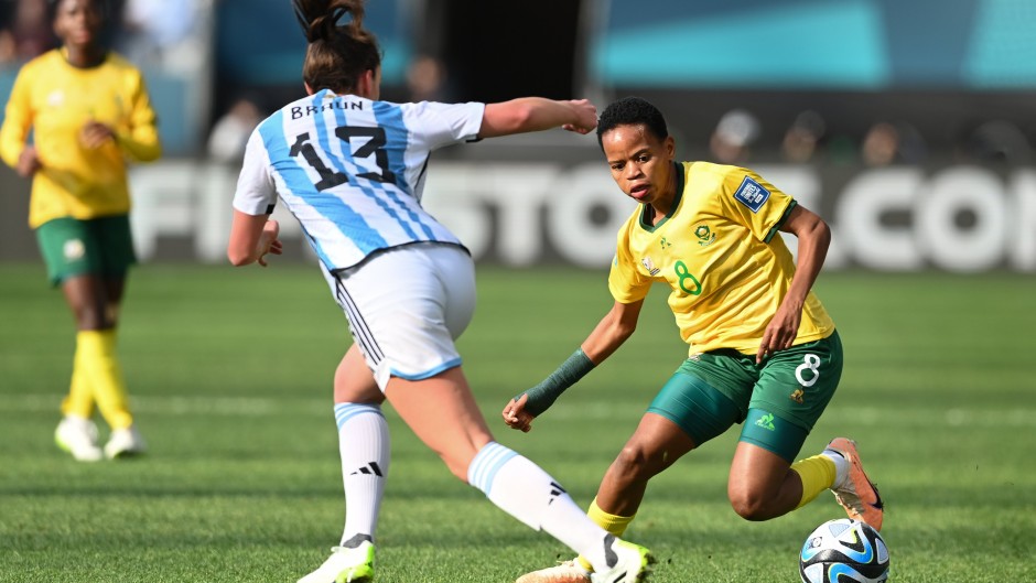 Argentina's defender #13 Sophia Braun (L) fights for the ball with South Africa's forward #08 Hildah Magaia during the Australia and New Zealand 2023 Women's World Cup Group G football match between Argentina and South Africa at Dunedin Stadium in Dunedin on July 28, 2023. (Sanka Vidanagama / AFP)