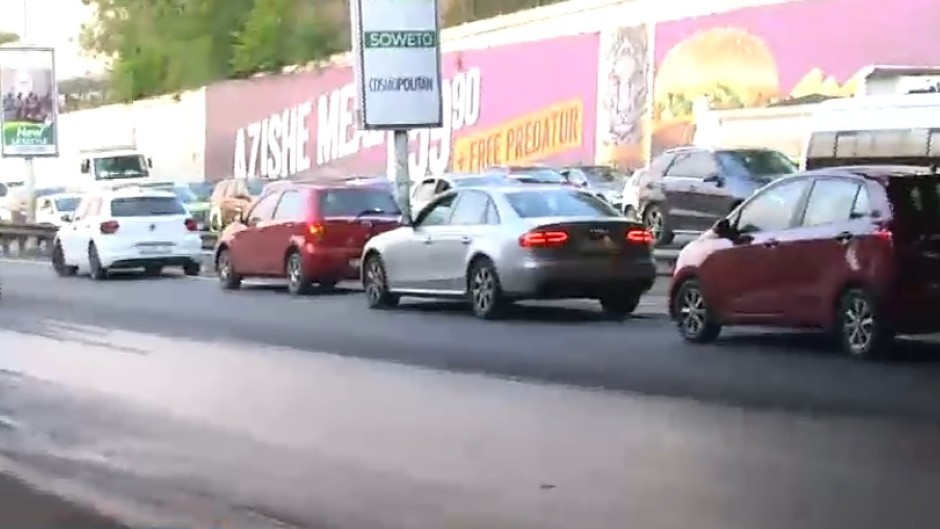 The South African Municipal Workers' Union is blocking Johannesburg's M1 highway with burning tyres and debris. (eNCA\screenshot)