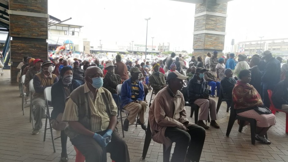 Pensioners and people with disabilities waiting for Sassa payouts at Jabulani Mall.