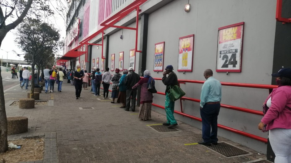 Sassa grant recipients keep a safe distance from each other in Athlone.