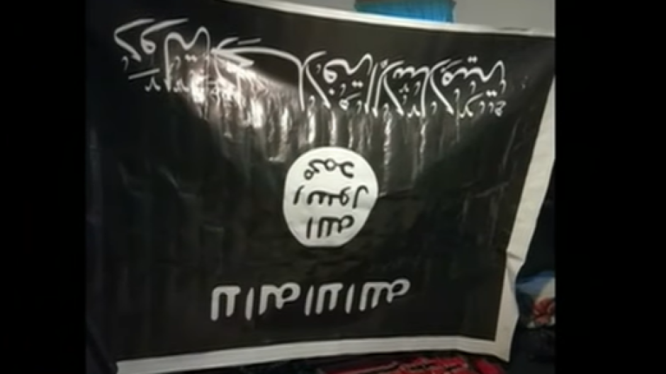 Police confiscated a black Isis flag among other illegal objects at a smallholding in Vaal, South of Johannesburg.