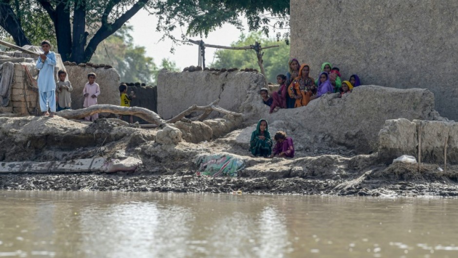 Many people are stranded in isolated hamlets above a landscape of water in the south and west