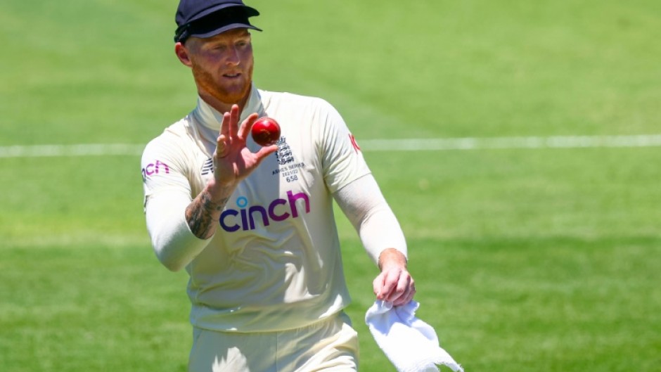 England's Ben Stokes shines the ball -- without using saliva, which has been banned permanently