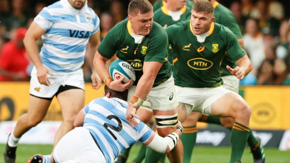 South Africa No. 8 Jasper Wiese (C) is tackled by Argentina hooker Julian Montoya