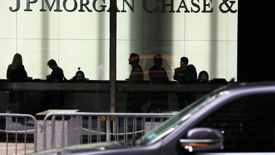 JPMorgan Chase reported lower quarterly profits as it set aside more funds in case of bad loans