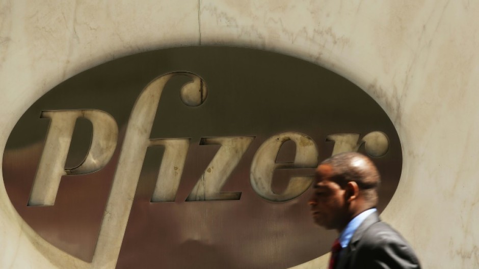 Pfizer lifted its full-year forecast for Covid-19 vaccine sales as it reported higher profits 