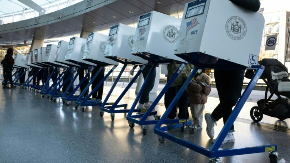 A sign with a US flag is seen at a polling station during early voting ahead of the US midterm elections in Los Angeles, California, on November 1, 2022