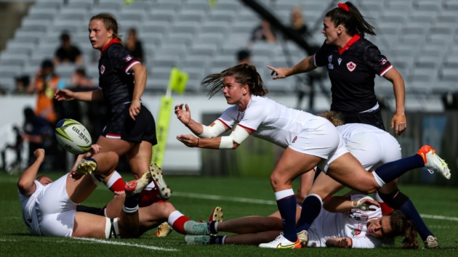 Scrum-half Leanne Infante (C) launches England's backs in their semi-final win over Canada at the women's Rugby World Cup