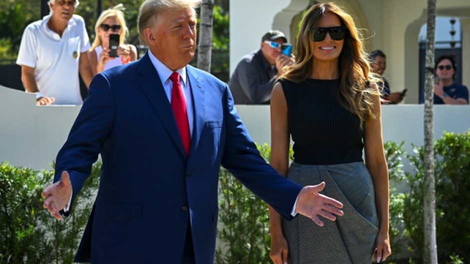 Former US President Donald Trump and his wife, Melania Trump, speak to reporters after voting in Palm Beach, Florida