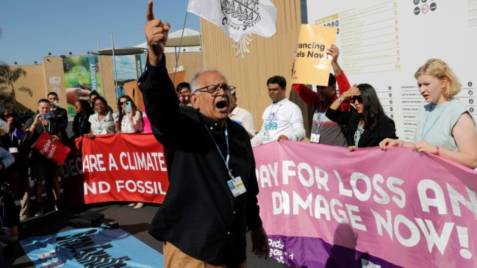 Climate activists stage a protest outside the Sharm el-Sheikh International Convention Centre on Friday