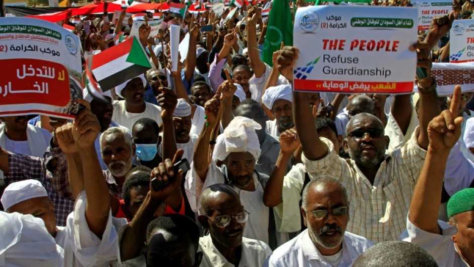 Sudanese protest against the United Nations mediation between Sudan's civilian and army leaders, outside the UN headquarters in the Manshiya district of the capital Khartoum