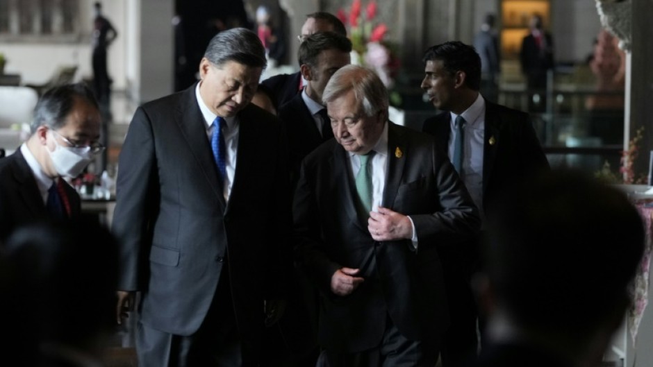 China's President Xi Jinping (L) and UN Secretary-General Antonio Guterres at the G20 leaders' summit in Indonesia