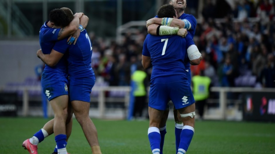 Italy's players celebrate their first victory over Australia