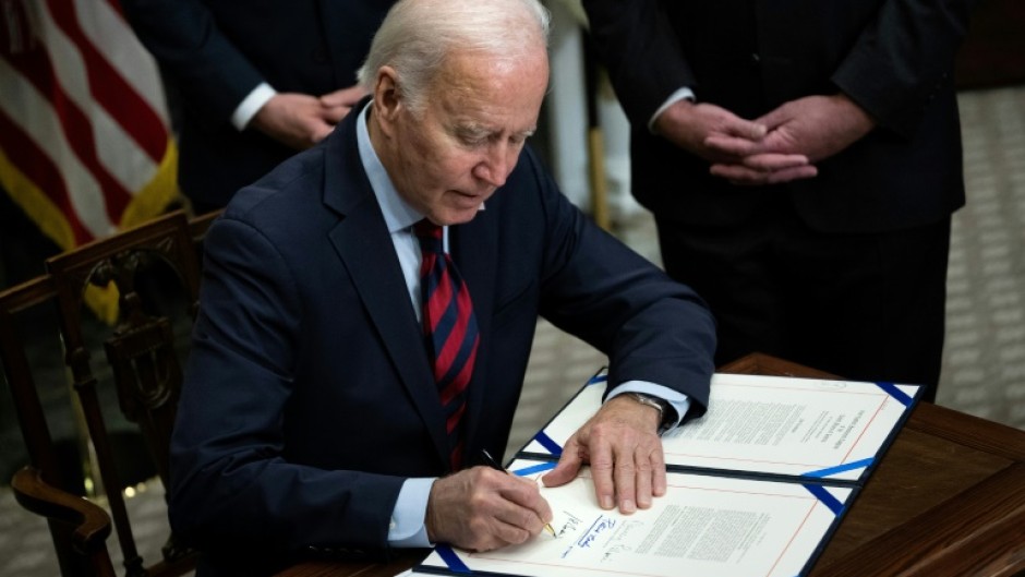 US President Joe Biden signs a resolution to avert a nationwide rail shutdown