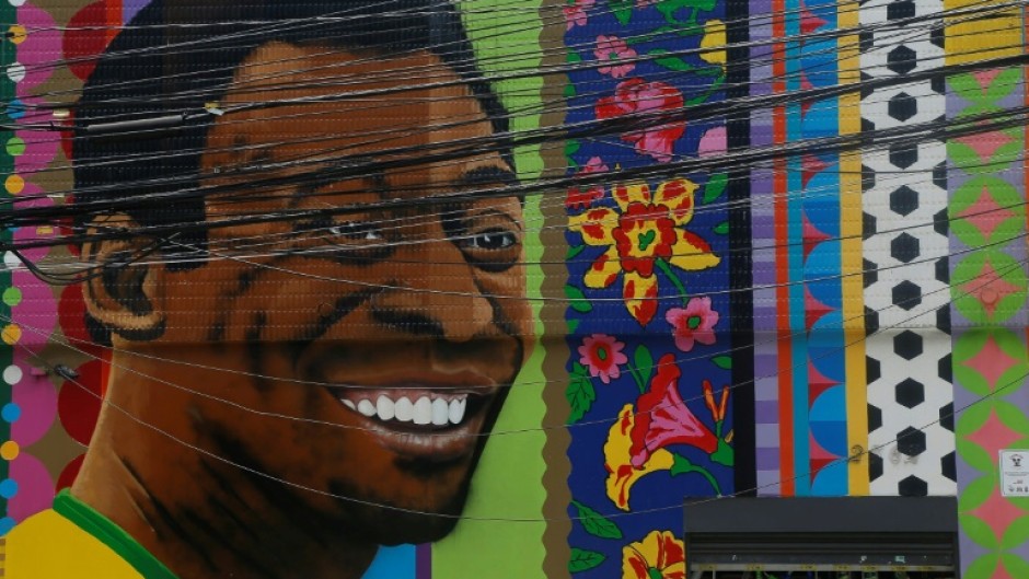 View of a mural depicting Brazilian football legend Pele by artist Aleksandro Reis in Sao Paulo on Saturday