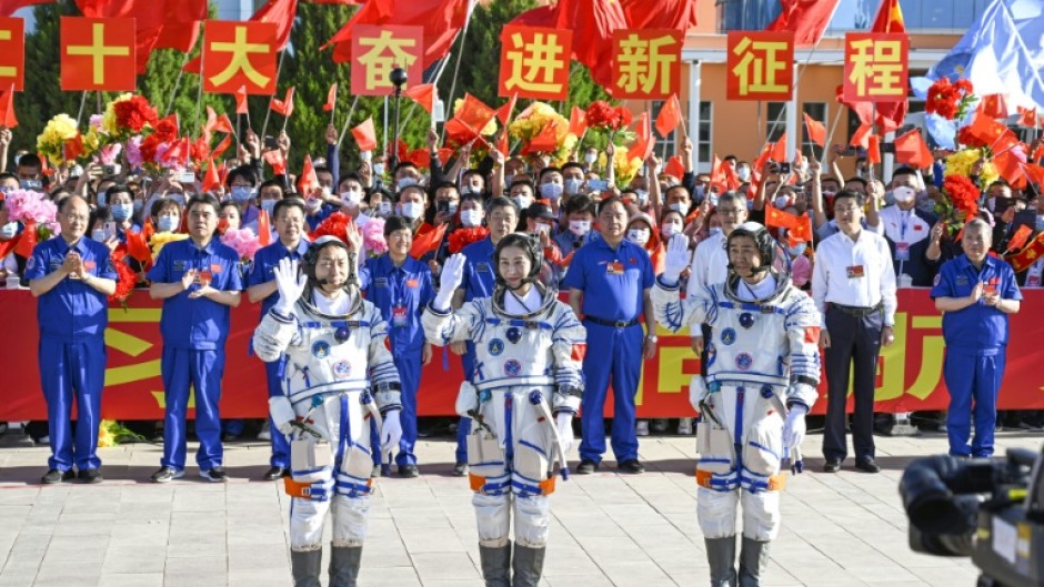 Chinese astronauts Cai Xuzhe (L), Chen Dong (C) and Liu Yang -- seen in June 2022 prior to their mission to the Tiangong space station -- have returned safely to Earth, state media reported