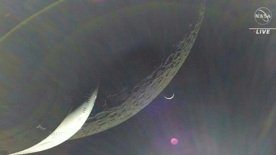 Earth is visible as a crescent in the minutes after Orion finished its engine burn around the Moon