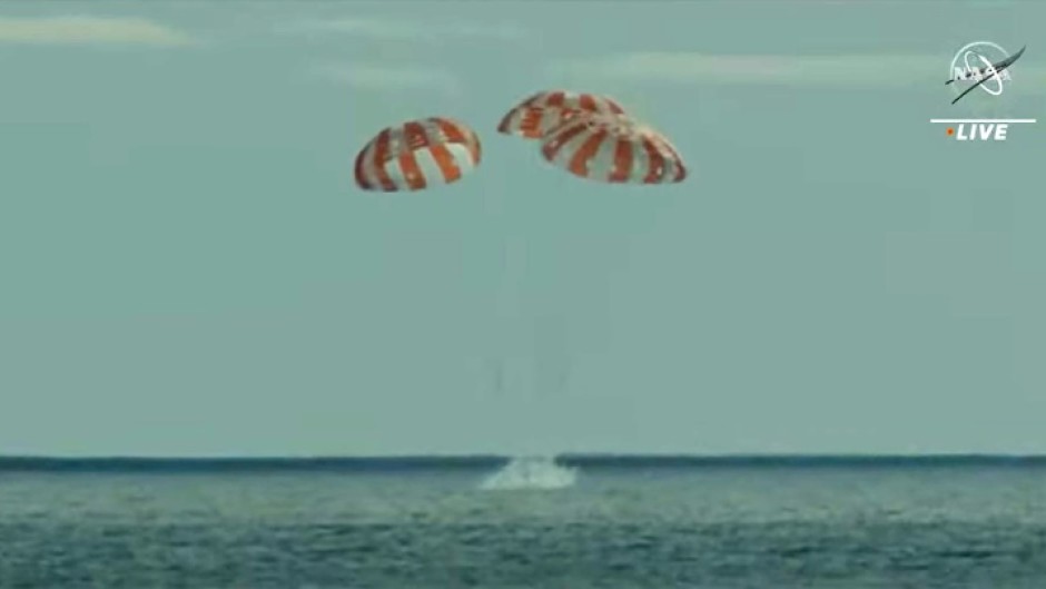 NASA's Orion space capsule, photographed at more than 432,000 km (268,000 miles) from Earth, a record for a habitable vessel, with our planet and the Moon in the background, in November 2022 