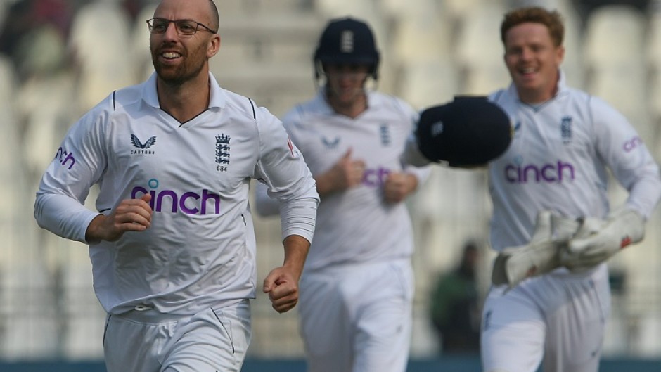 England's Jack Leach (L) celebrates the dismissal of Pakistan's Saud Shakeel, his 100th Test wicket