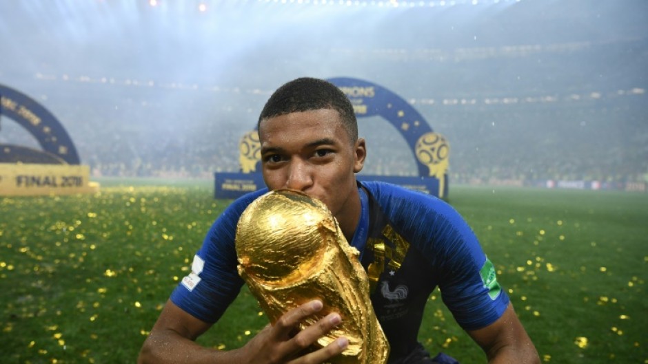 Kylian Mbappe kisses the World Cup trophy after France beat Croatia 4-2 in the 2018 final in Moscow