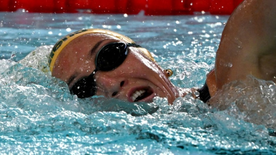 Australia's Lani Pallister became the furst swimmer to win the 400-800-1500m freestyle at a short course world championships  