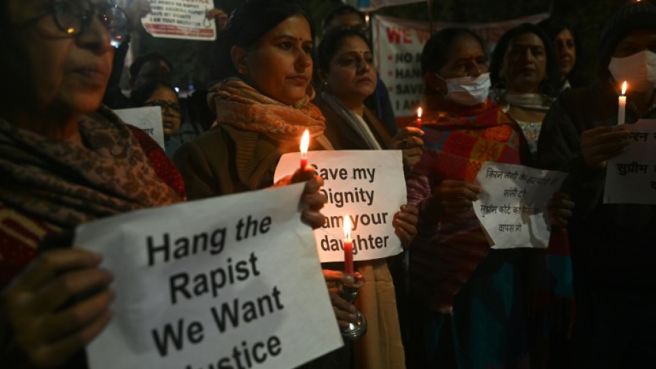 Activists and campaigners hold a candlelight vigil for Jyoti Singh, who was brutally gang-raped and murdered on a New Delhi bus 10 years ago