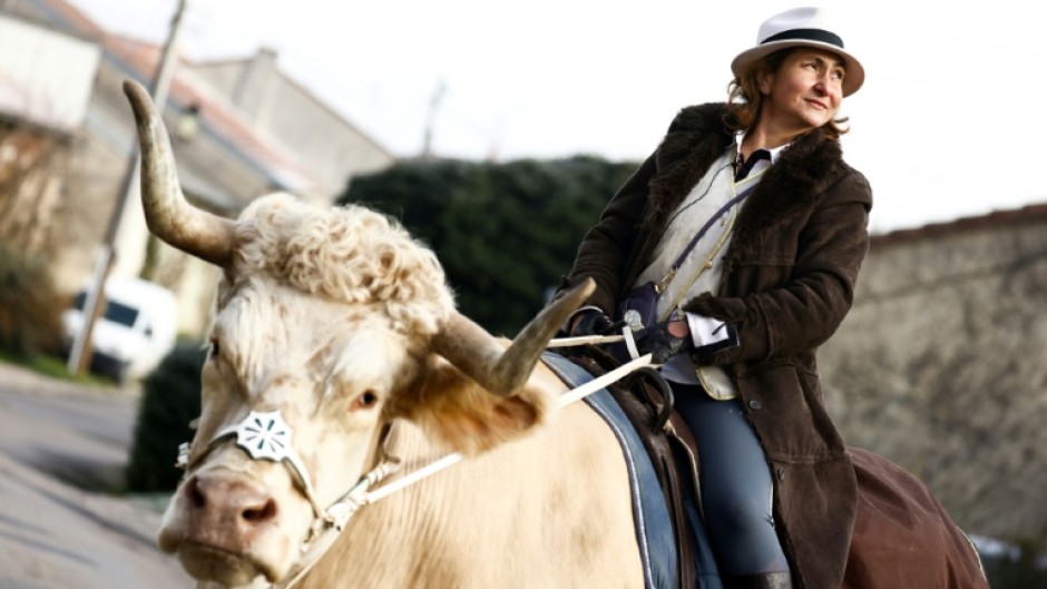 Sabine Rouas and her bull Aston still cause a stir when they go out for a ride in their northern French village