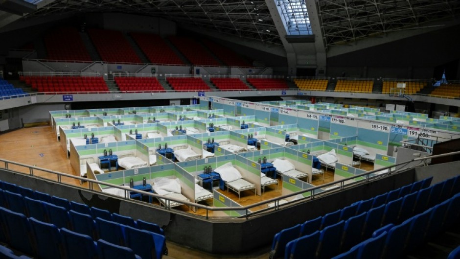 Beds for patients are seen in partitioned rooms at a makeshift fever clinic at a stadium amid the Covid-19 pandemic in Beijing on December 20, 2022.