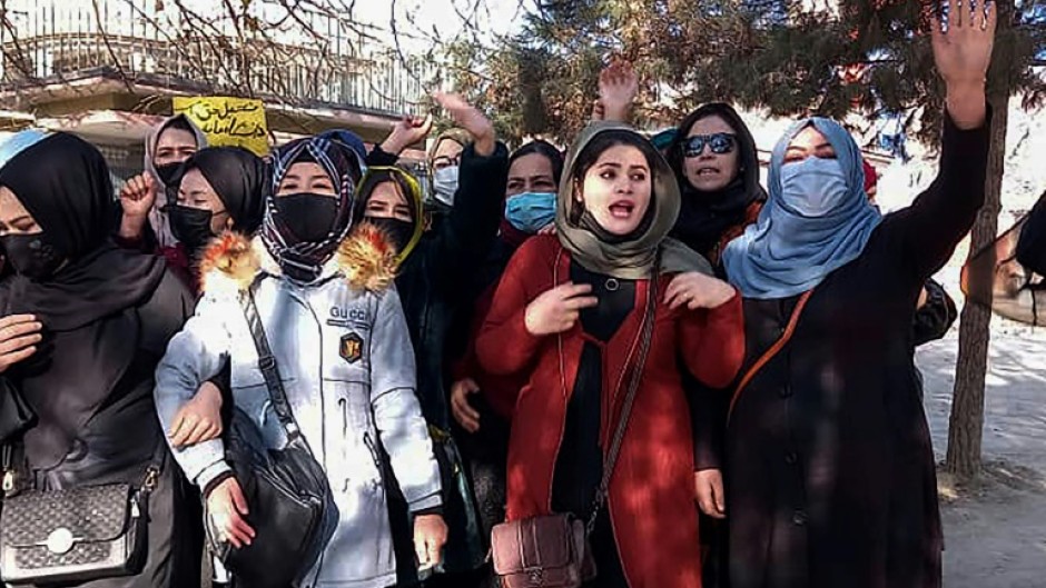 Small groups of Afghan women staged protests in Kabul Thursday to protest against them being banned from university