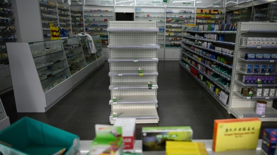 Empty shelves at a pharmacy in Beijing. Cities have been struggling to cope with surging infections since China dropped its zero-Covid policy