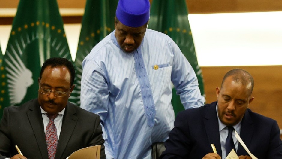 Peace deal: Ethiopian government representative Redwan Hussein, left, and Tigray's Getachew Reda at the November 2 signing ceremony in Pretoria