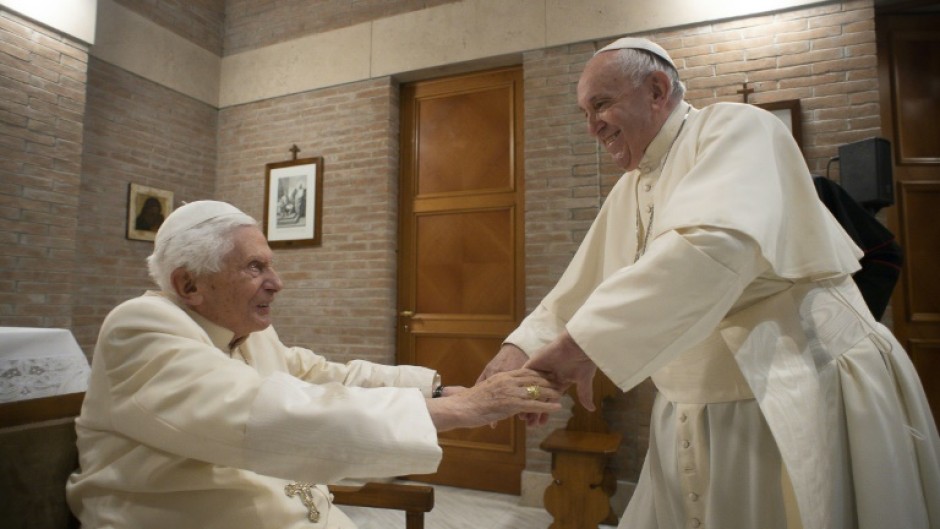 Pope Francis (R) sparked alarm on Wednesday by revealing at his general audience that his predecessor, former pope Benedict (L), was "very ill"