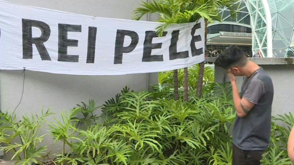 Pele fans mourn his death outside the hospital in Sao Paulo where he was treated 