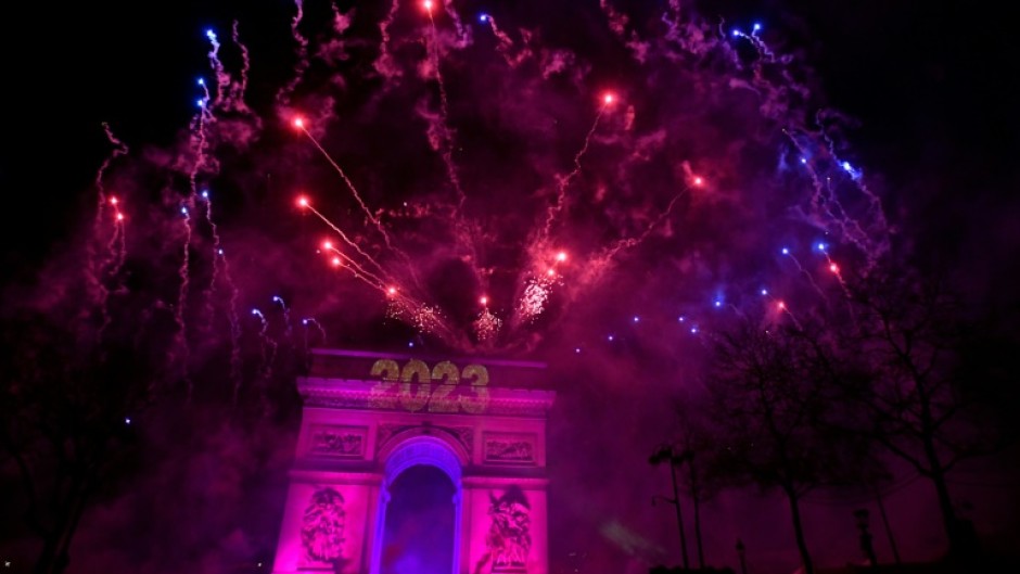 Fireworks explode over the Arc de Triomphe as France ushers in 2023