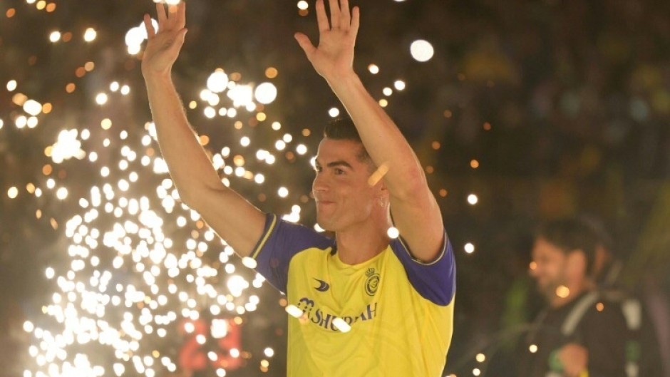 Al-Nassr's new Portuguese forward Cristiano Ronaldo greets fans during his unveiling at the Mrsool Park Stadium in Riyadh