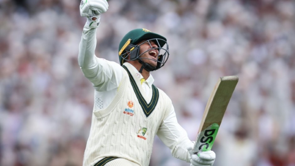 Australia’s Usman Khawaja celebrates reaching his century during day two of the third cricket Test match between Australia and South Africa at the Sydney Cricket Ground (SCG) in Sydney