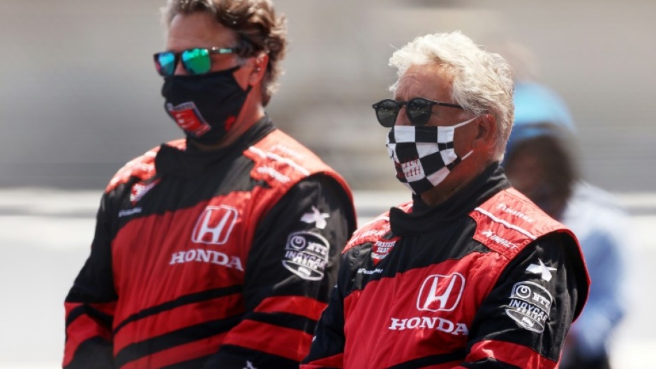 Mario Andretti and his son Michael stand on the grid prior to the 104th running of the Indianapolis 500 at Indianapolis Motor Speedway in August 2020