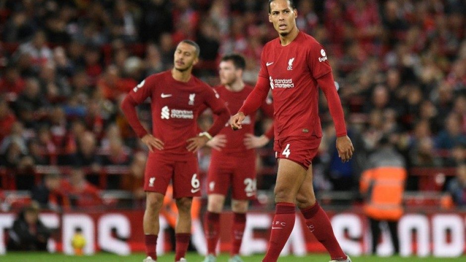 Injured - Liverpool defender Virgil van Dijk (R) 