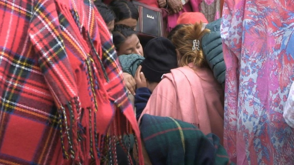 Families of Nepal plane crash victims wait for the release of bodies outside Pokhara hospital