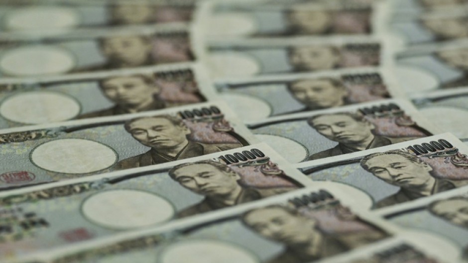 The yen sank back past 131 per dollar after the Bank of Japan left monetary policy unchanged