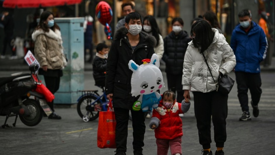 Wuhan, the Chinese city synonymous with with Covid-19, springs back to life for Lunar New Year's Eve, but many are mourning family members lost during the pandemic